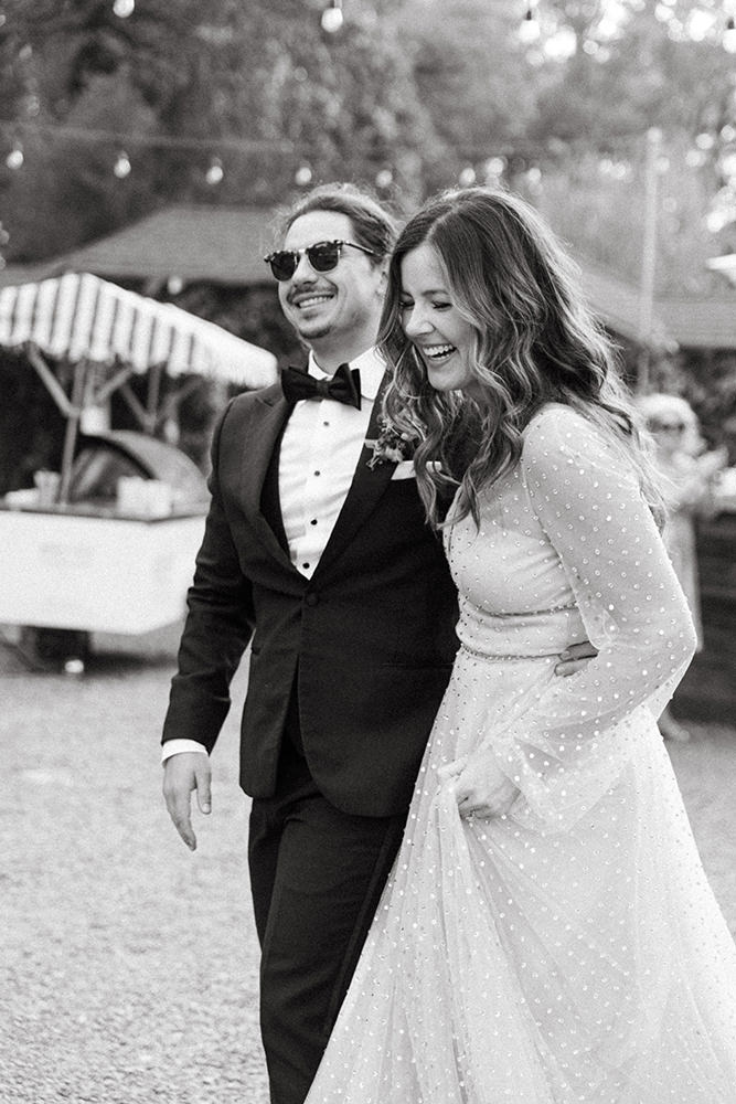 Bride and Groom walk into their wedding reception at Yokayo Ranch in mendocino